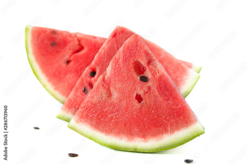 Slices of juicy ripe red watermelon on a white background. Fresh watermelon juice. Cocktails and soft drinks with watermelon. Slices of juicy ripe red watermelon on a white background. Fresh watermelon juice. Cocktails and soft drinks with watermelon.