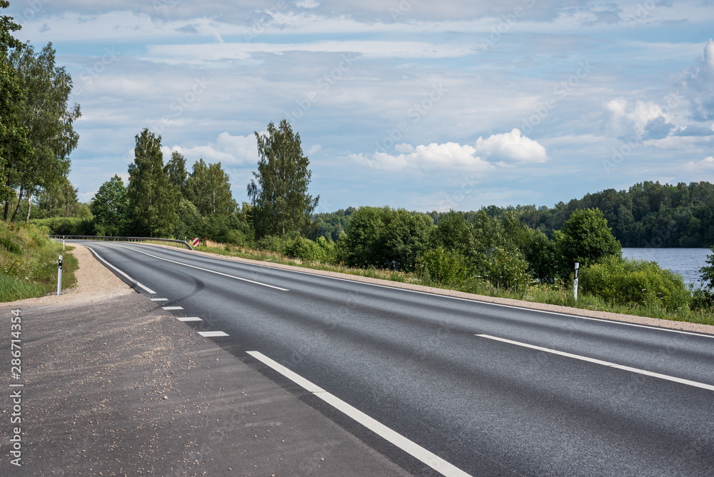 View to empty asphalt road. View to empty asphalt road.