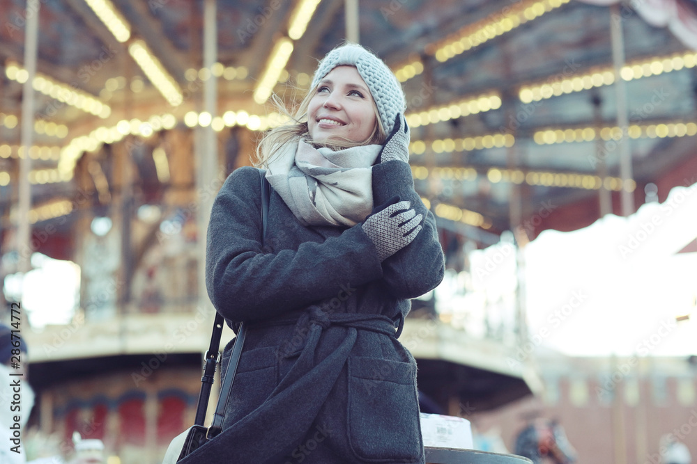 Dreaming woman in winter city a festive mood Dreaming woman in winter city a festive mood