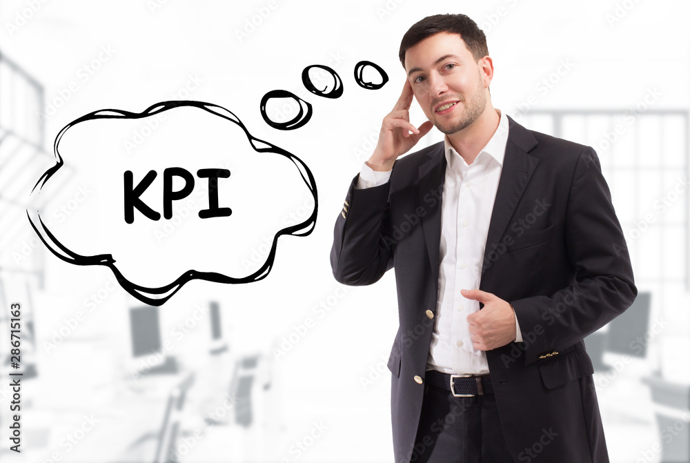 Business, technology, internet and network concept. The young businessman comes up with the keyword: KPI Business, technology, internet and network concept. The young businessman comes up with the keyword: KPI