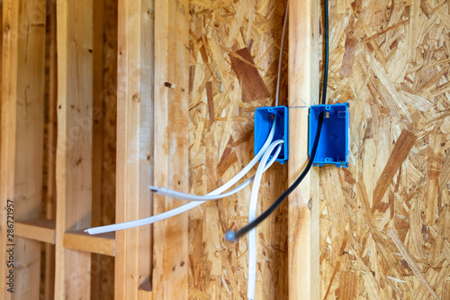 Electrical wiring and CATV cable in walls of new home construction