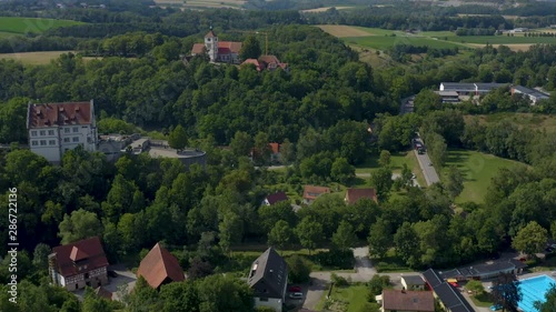 Aerial view of the village and castle Vellberg in Germany on a sunny day in spring. Ascending beside the castle. photo