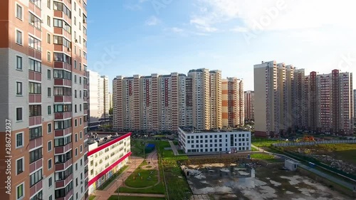 A drone flies over a road in the courtyard of a residential area. City infrastructure. photo