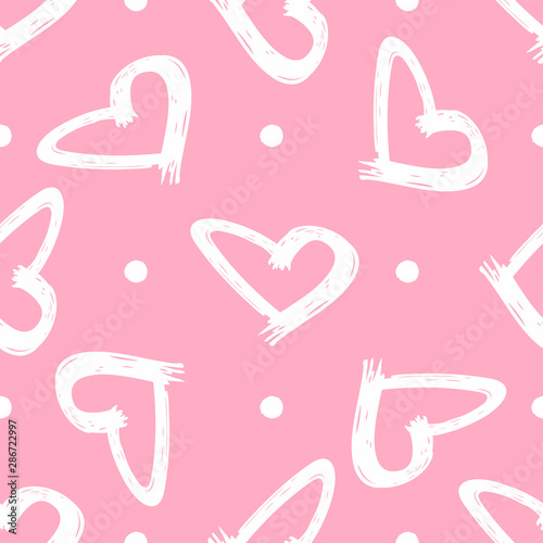 Cute seamless pattern with dots and hearts painted by brush. Sketch, grunge, graffiti. Cute vector illustration.