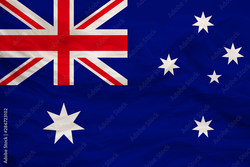 Fototapeta premium national flag of Australia on delicate silk with wind folds, travel concept, immigration, politics