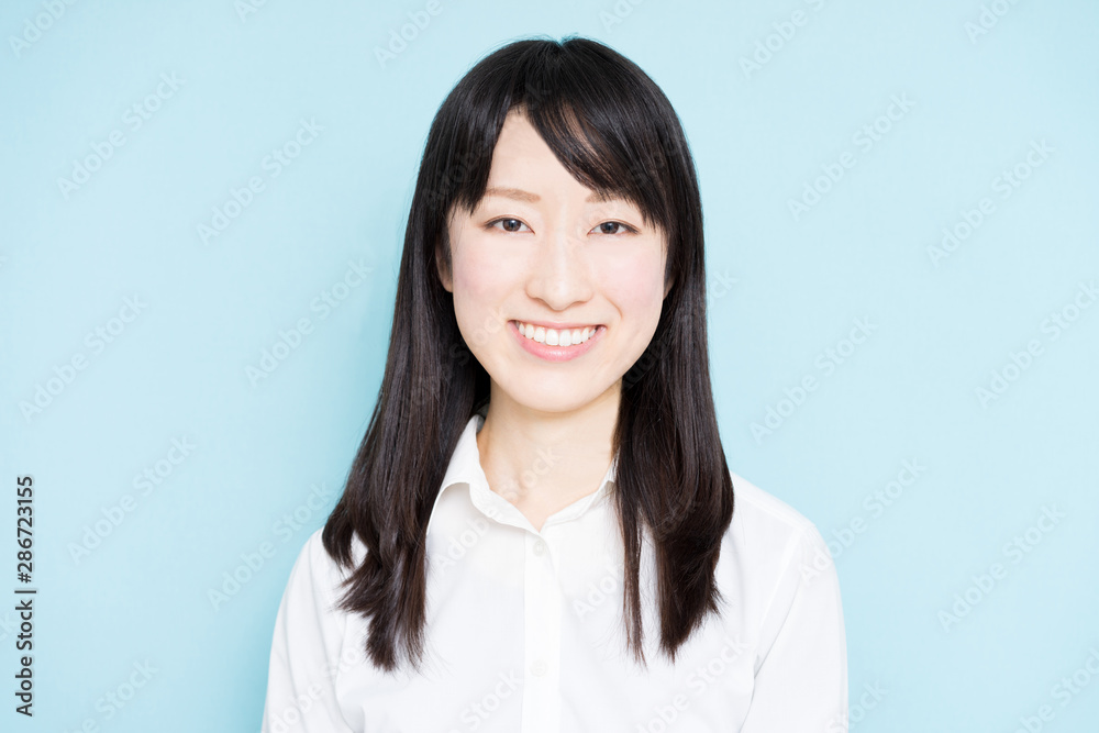 Happy business woman against light blue background Happy business woman against light blue background