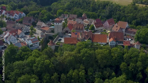 Aerial view of the village and castle Vellberg in Germany on a sunny day in spring. Pan to the right beside the castle. photo