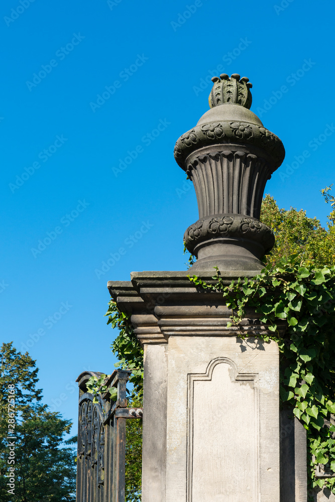 column with vase, entrance of historic Public Park called Schlosspark. Bad Bentheim, Germany