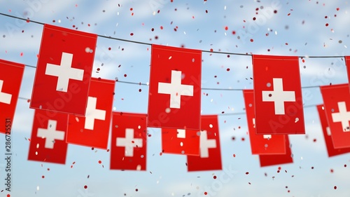Slika na platnu Swiss flags in the sky with confetti.
