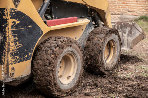 Excavator machine working on during a construction.