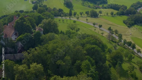 Aerial view of the castle Tannenburg in Germany on a sunny day in spring. Pan to the left from the back. photo