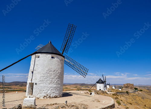 Old windmills and castle in the town of Consuegra, Spain