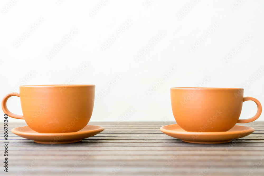 cup of coffee on wooden table cup of coffee on wooden table