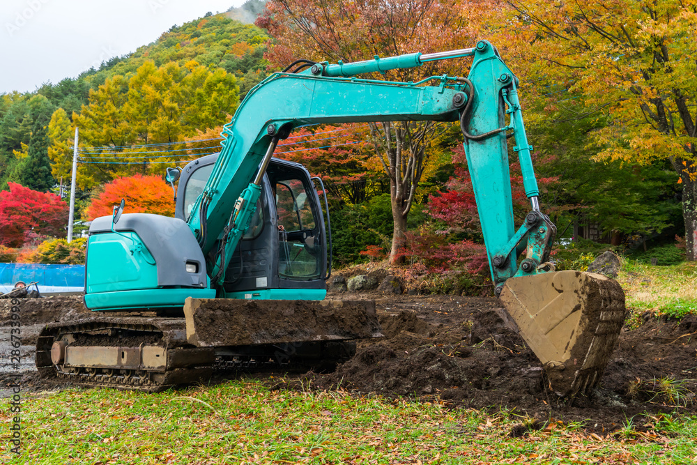 Excavators machine in park. Excavators machine in park.