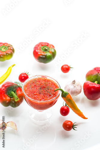 homemade hot adjika from tomatoes, hot and sweet peppers with spices