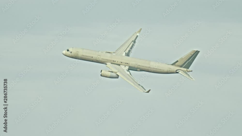 Passenger plane flying in the sky in overcast weather