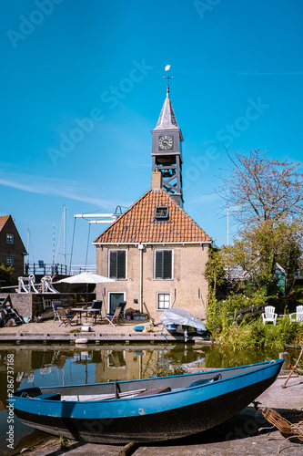 Friesland Netherlands Hindeloopen, old town during summer by the canals, dutch historical village photo