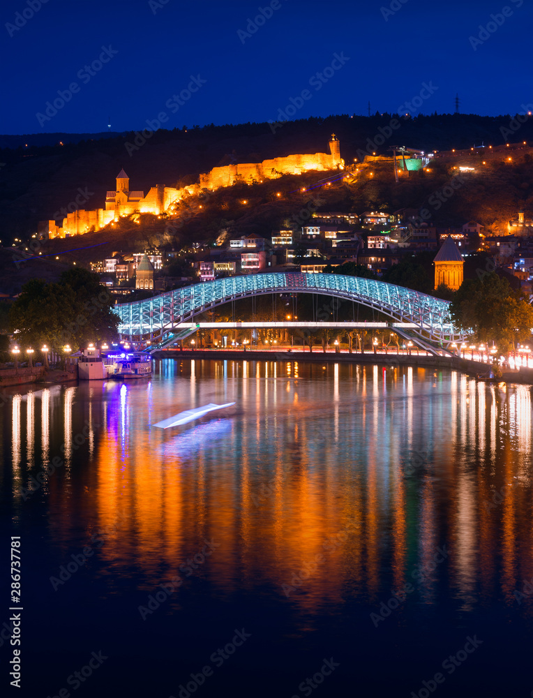 Bridge of Peace and Narikala Fortress at night. Tbilisi, Georgia