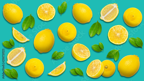 Minimal style creative layout made of lemon and leaves , half of lemon , slide, piece. flat lay. Fruit concept.