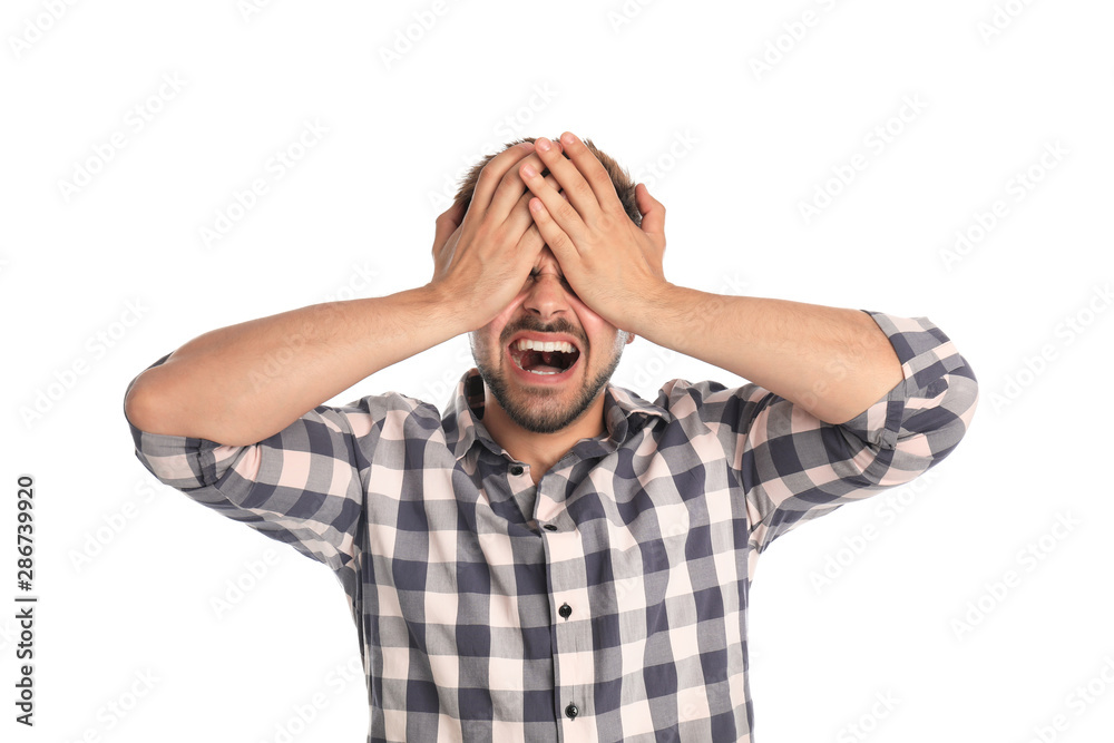 Young man being blinded on white background Young man being blinded on white background