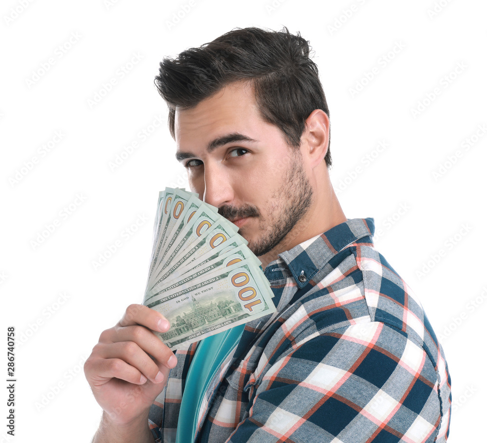 Handsome young man with dollars on white background Handsome young man with dollars on white background