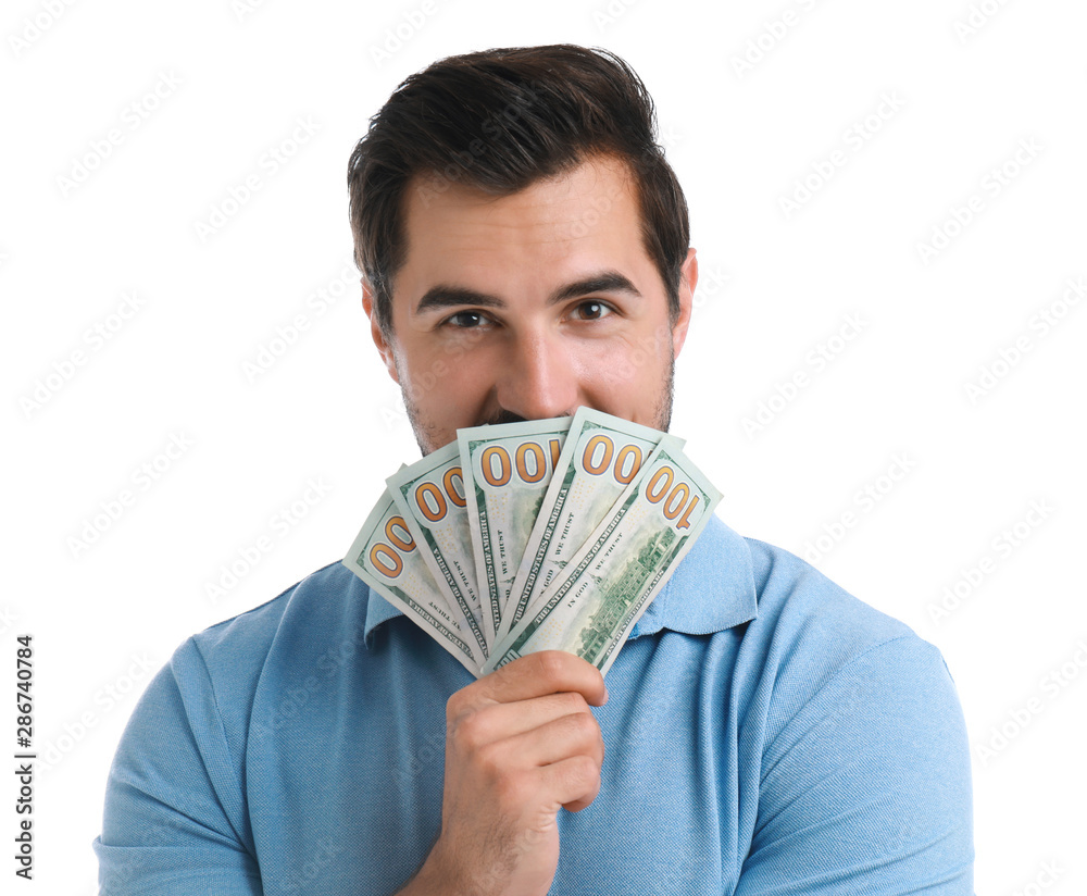 Handsome young man with dollars on white background Handsome young man with dollars on white background