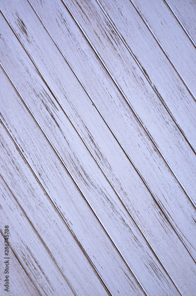 Obraz premium light background in the form of hammered together wooden boards. painted with white paint with scuffs