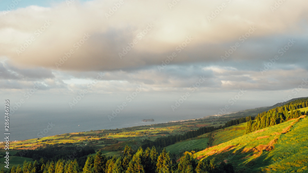 Naklejka premium Sunrise at Sao Jorge Island, seen from Castelo Branco at the Azores, Portugal