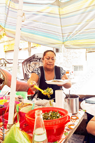 Candid portrait of woman serving food