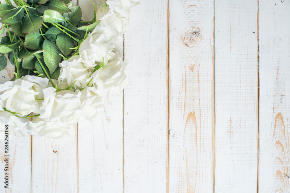Top view of wedding flowers on white wood background Top view of wedding flowers on white wood background