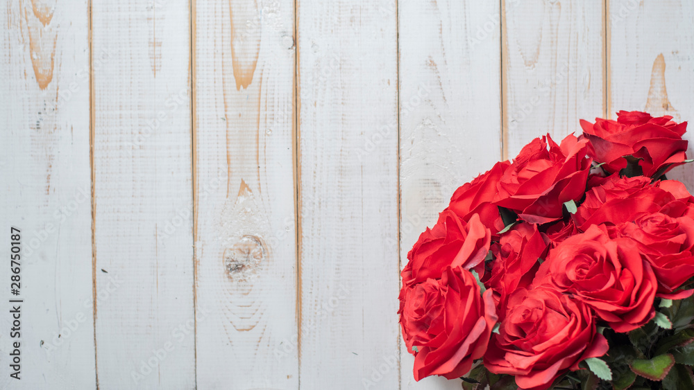 Top view of wedding flowers on white wood background