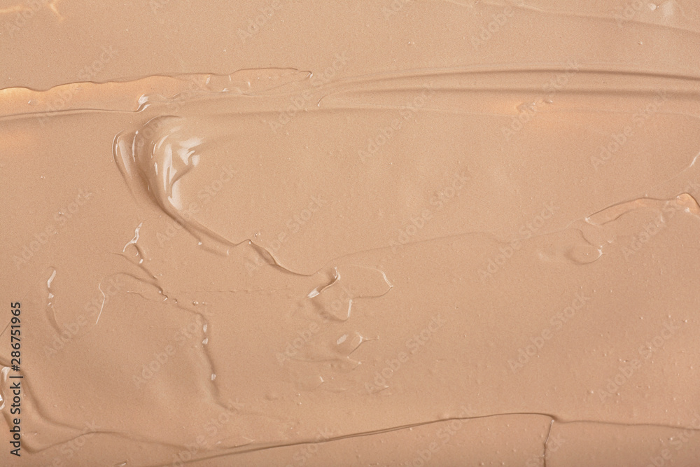 Obraz premium Concealer smear makeup texture background. Liquid foundation.