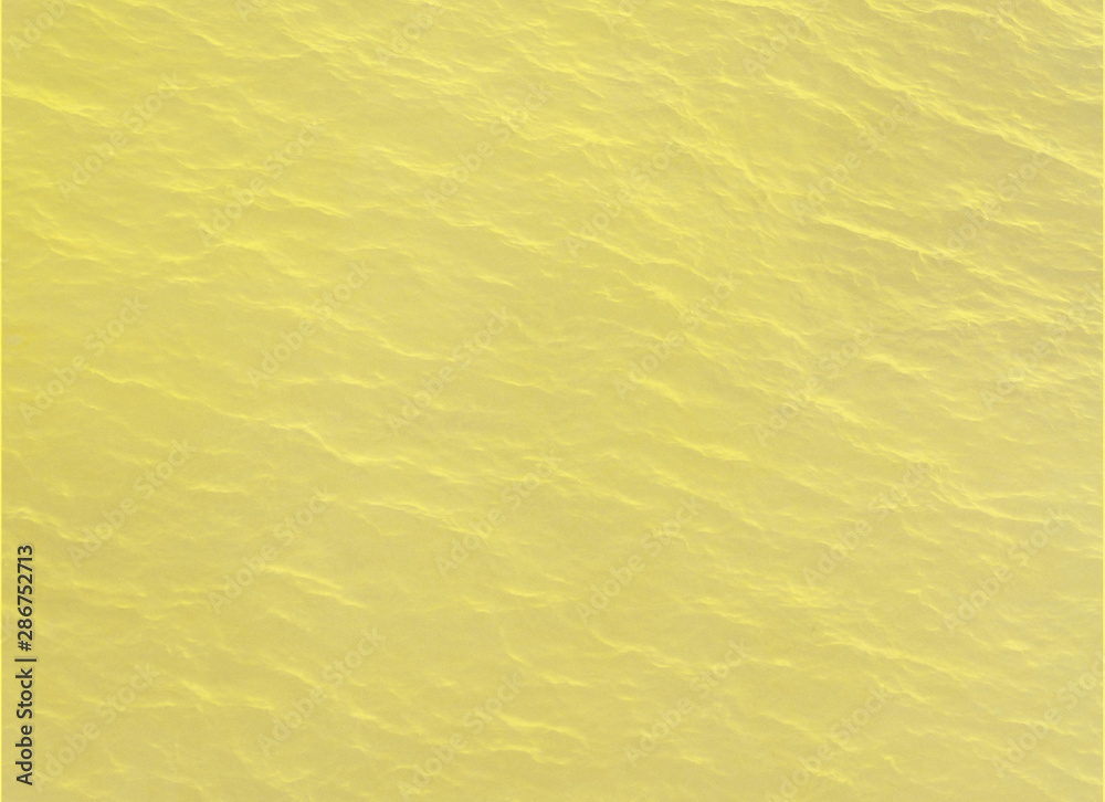 Crop view of stone background. Fresh yellow color texture