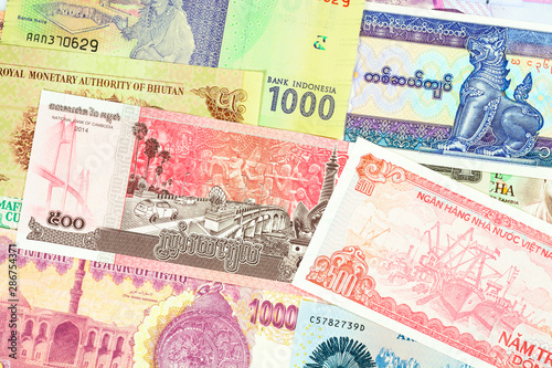 Old paper banknotes from exotic countries of Asia and Africa. Colorful money background 3. Close up high resolution.