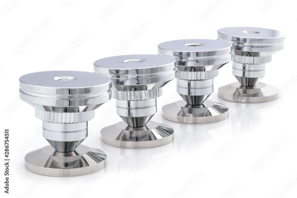 Audio stainless steel cone spike. Set of four adjustable shockproof  isolation feet for audio. Stand pad for speaker, amplifier, turntable, DAC,  recorder. Close up on white background. Stock-Foto | Adobe Stock