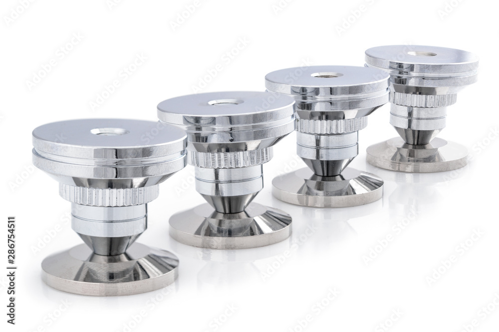 Audio stainless steel cone spike. Set of four adjustable shockproof isolation  feet for audio. Stand pad for speaker, amplifier, turntable, DAC, recorder.  Close up on white background. Stock-Foto | Adobe Stock