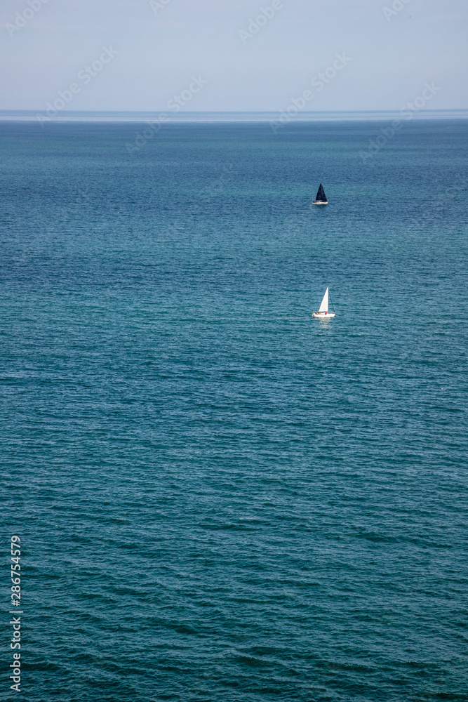 Sail boats in the ocean in Bray