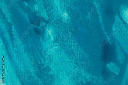 Abstract turquoise watercolor background. Blue color splashing in the paper. Acrylic painting texture.