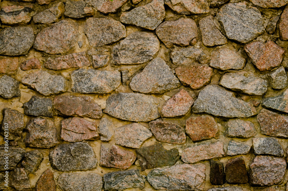 Fototapeta premium Masonry. Old masonry. The wall is built of stone. Architectural texture. Building stone.