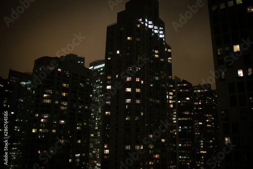 Windows illuminated in apartments and skyscrapers in Chicago at night