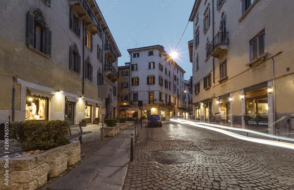 Ancient street in Verona in the evening