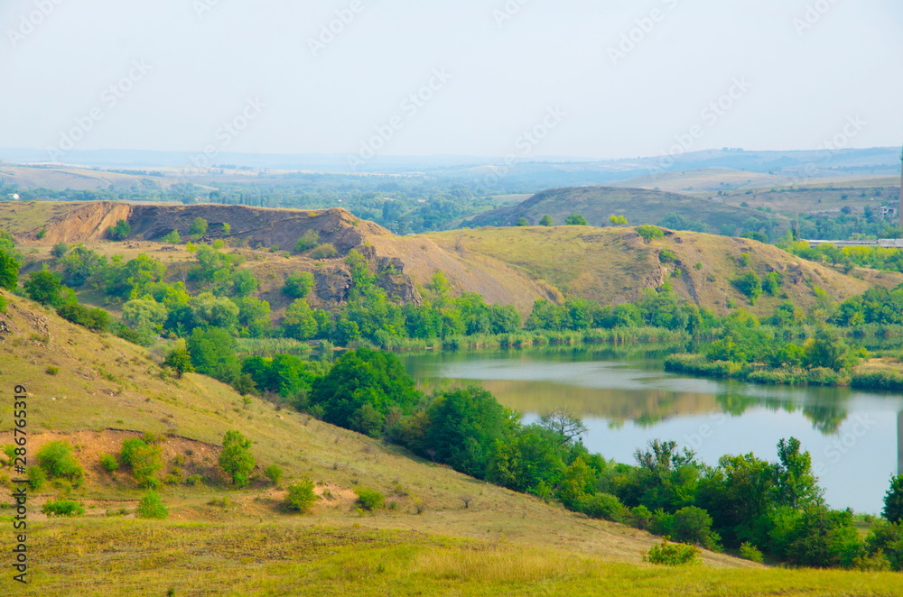 Part of the Shterovskoye reservoir on the background of the rock mass of the Donetsk Ridge.