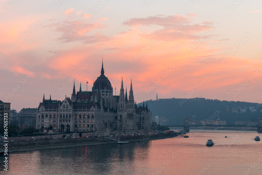 Fototapeta Aerial view of Budapest parliament and the Danube river at sunset, Hungary.