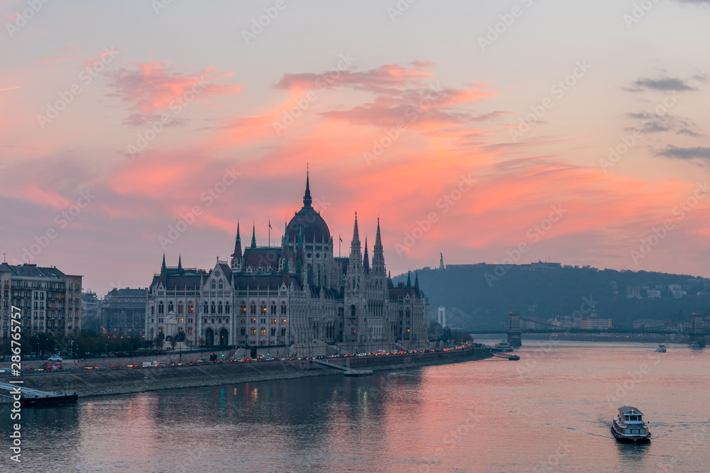 Aerial view of Budapest parliament and the Danube river at sunset, Hungary.