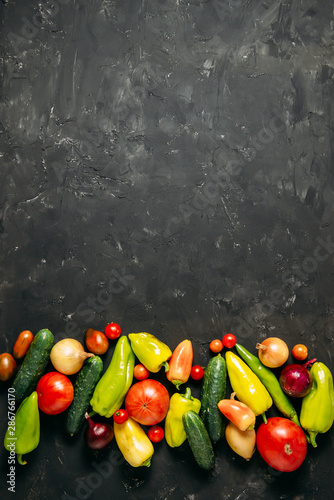 Fototapeta Naklejka Na Ścianę i Meble -  Vegetables on a dark wooden background. Place for text