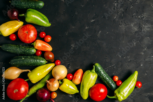 Vegetables on a dark wooden background. Place for text