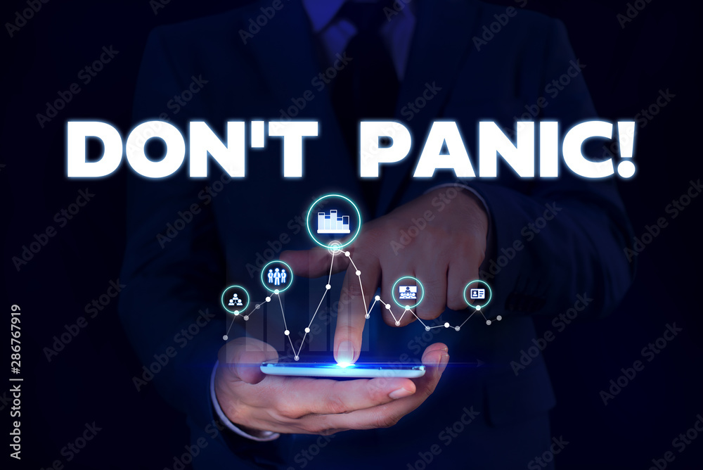 Fototapeta premium Writing note showing Don T Panic. Business concept for suddenly feel so worried or frightened that you can not behave Male wear formal suit presenting presentation smart device