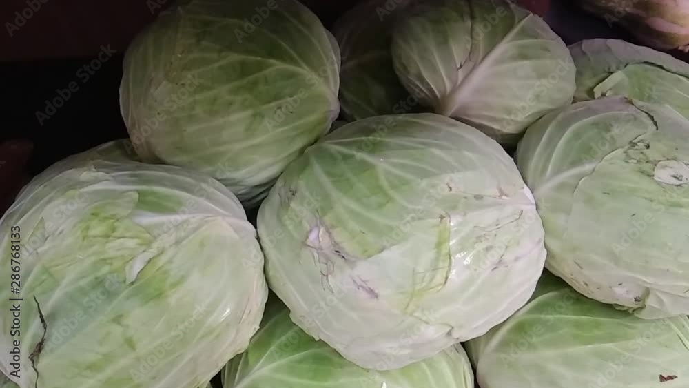 box full of green cabbage in supermarket, exposed for the consumer to choose box full of green cabbage in supermarket, exposed for the consumer to choose