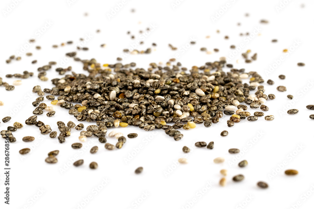 Organic Chia Seed, super food over white background. Healthy breakfast, vitamin snack, diet and healthy eating concept. Organic Chia Seed, super food over white background. Healthy breakfast, vitamin snack, diet and healthy eating concept.