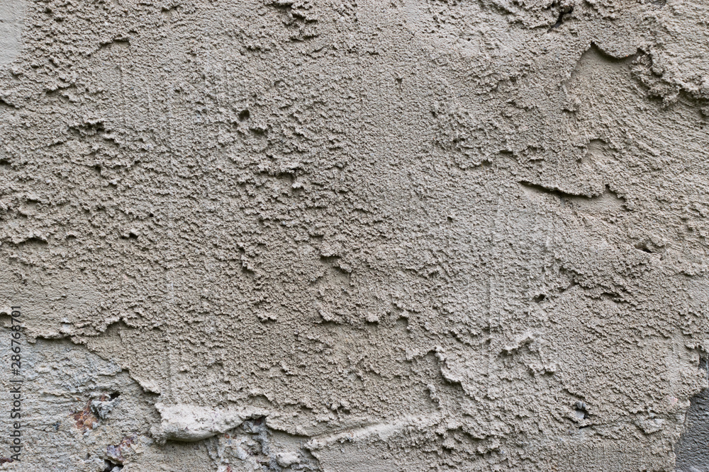 Old gray concrete wall with yellow and brown spots as an abstract background Old gray concrete wall with yellow and brown spots as an abstract background